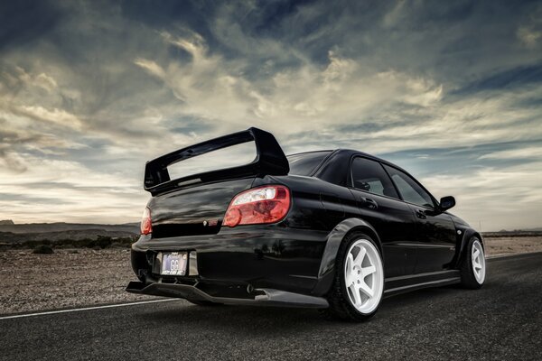 Subaru impreza against a cloudy sky