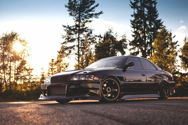 Toyota chaser on the background of the forest