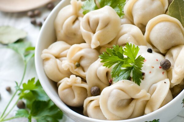 Dumplings with herbs and pepper in a plate