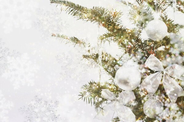 Christmas decorations. White bows and balloons