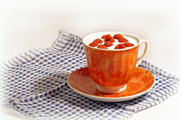 Raspberry tea in an orange mug