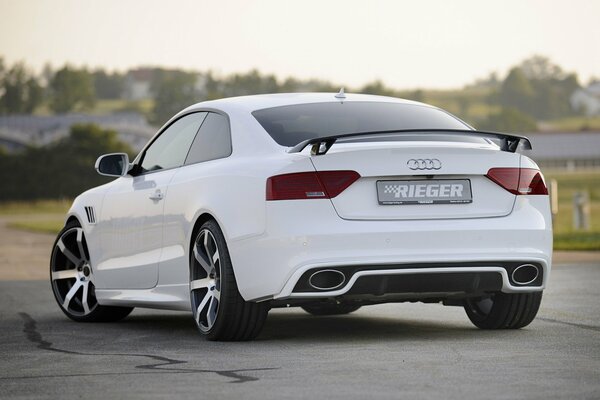 White Audi with cool wheels in the city