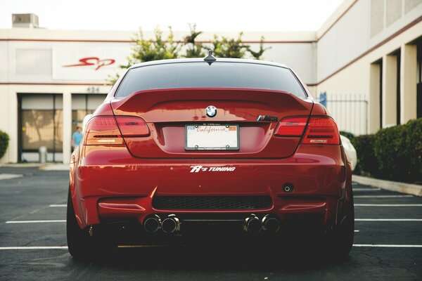 Red bmw in the parking lot rear view