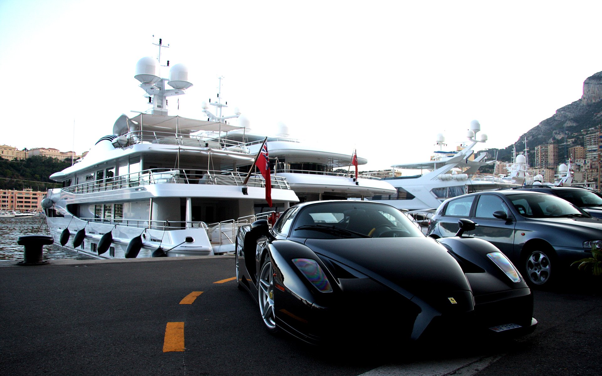 ferrari enzo black parking yacht mountain town