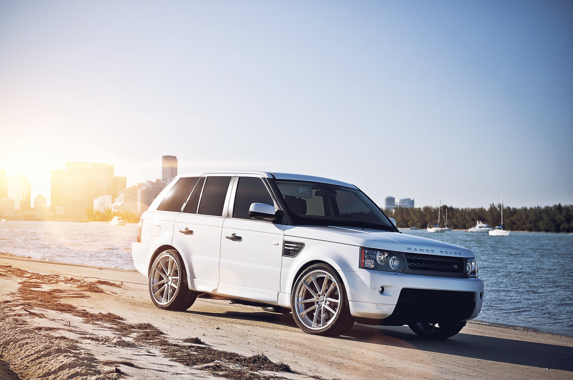 land rover range rover sport white land rover range rover city metropolis beach sand river yachts sun glare