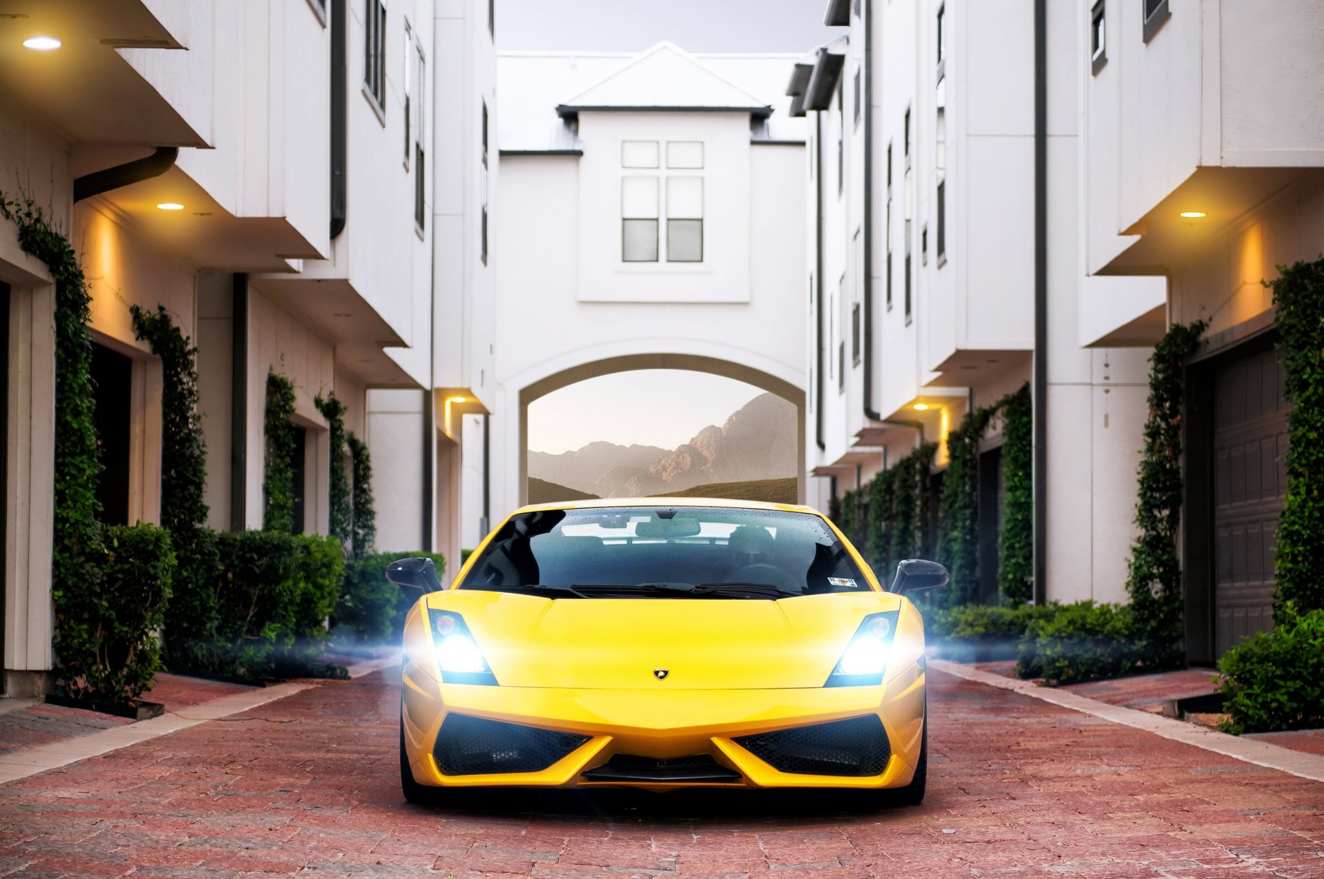 lamborghini gallardo superleggera yellow lamborghini lamborghini gallardo superleggera building garages paving stones glare