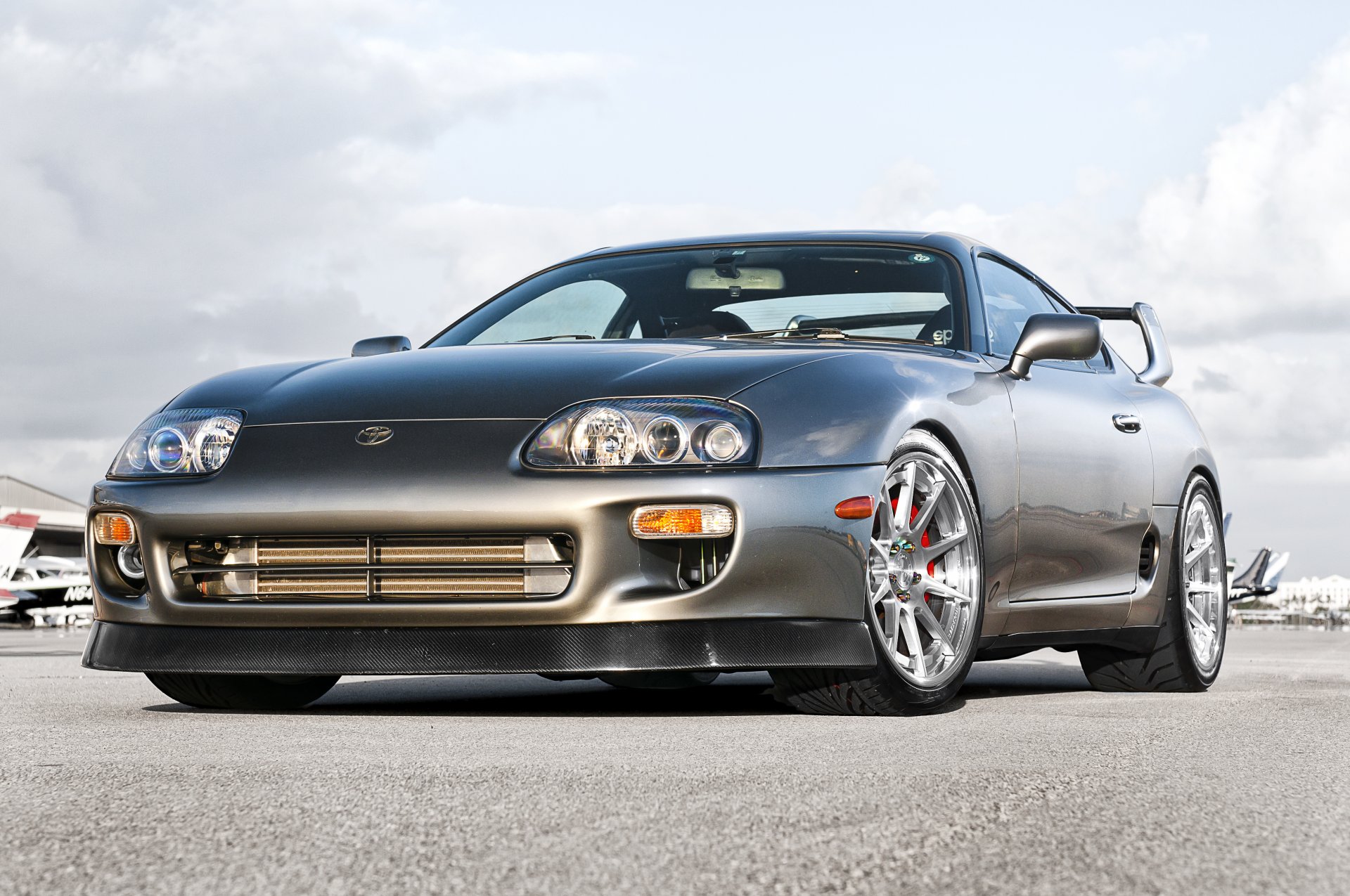 toyota above silver toyota supra silver front sky clouds reflection