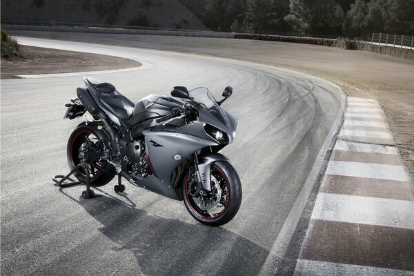 Grey Yamaha R1 motorcycle on the track