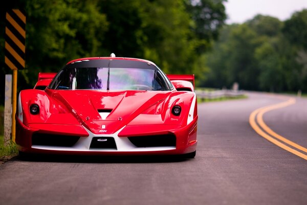 Red Ferrari at the road sign