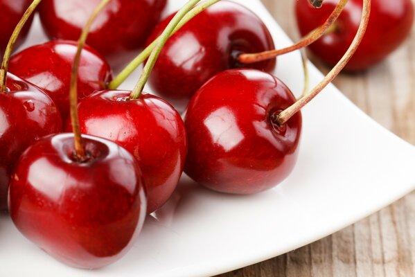 Large cherry on a white plate