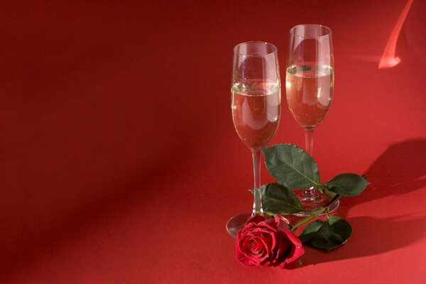 Champagne glasses on a red background