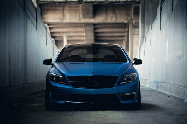 Blue Mercedes with tuning in the tunnel