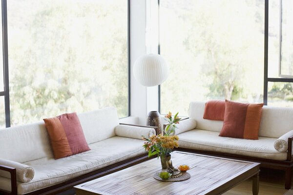 Antique sofas in the interior with panoramic windows