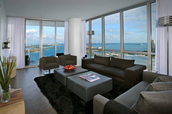 Modern interior with panoramic windows on a beautiful sea view