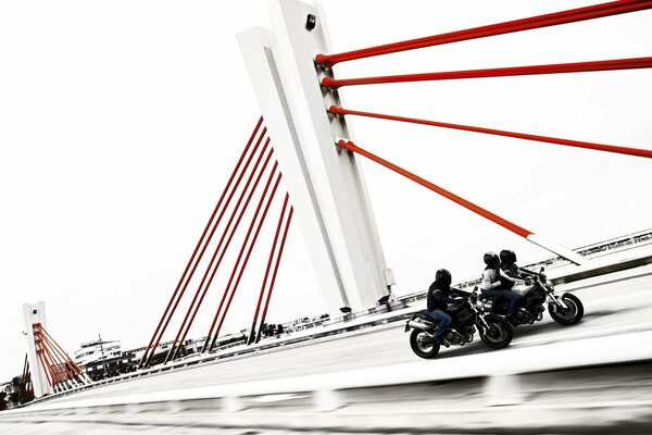 Motorcyclists riding on the bridge white background