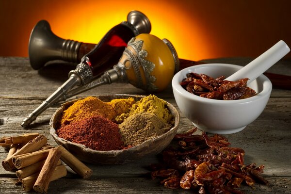 Still life with spices. Ground seasonings and devices for working with them