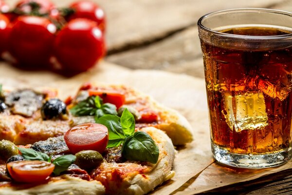 Coca-Cola with ice and pizza