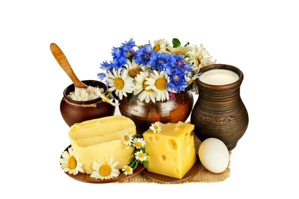 Dairy products and eggs with a jug of flowers