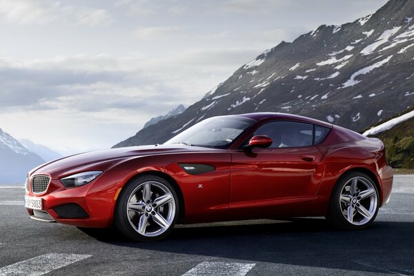 Bmw Stands on the road against the backdrop of mountains