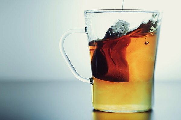 Tea bag in a transparent cup