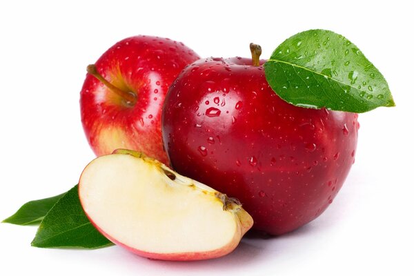 Red apples with leaves on a white background