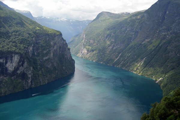 A fjord with green-covered shores in Norway