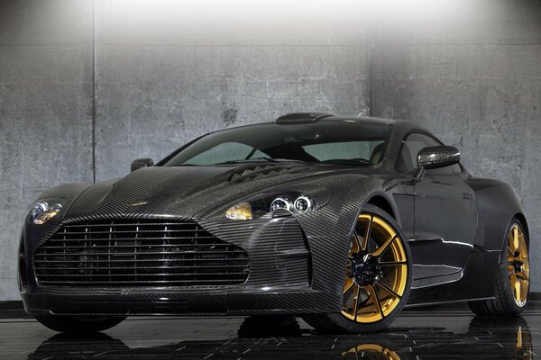 Beautiful Aston Martin car with golden wheels