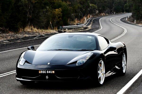 Luxury black Ferrari on the roads of Italy