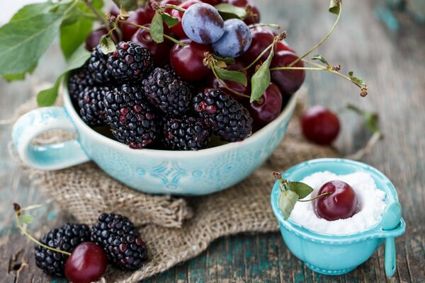 Beautiful berries on a blue saucer