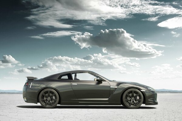 Nissan car on sand and clouds