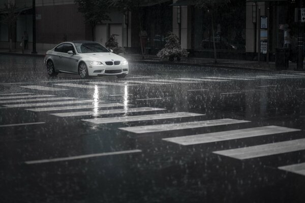 Bmw in the city during the rain