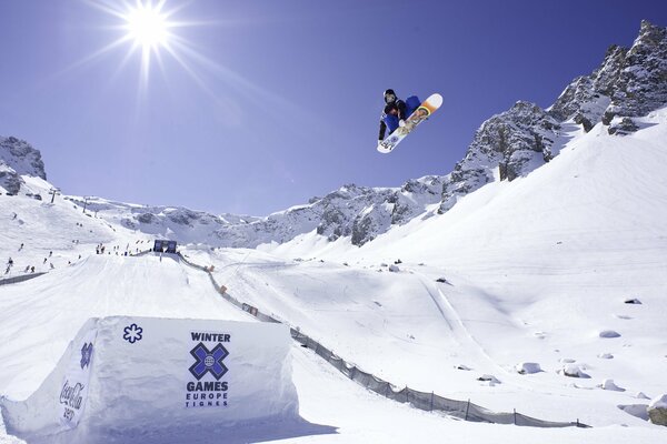 A snowboarder does a trick in the air