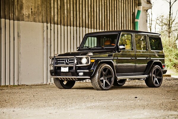 Black tuning Mercedes SUV. Yellow