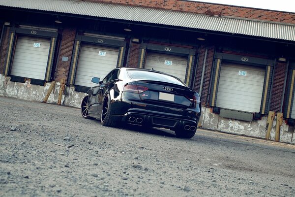 Audi s5 black on dirt road