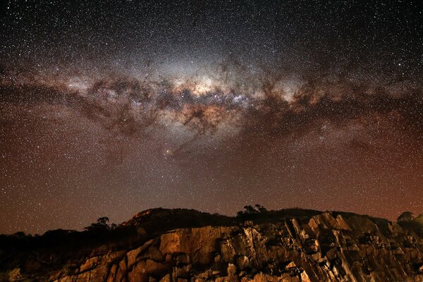 Stars and the Milky Way over rocks