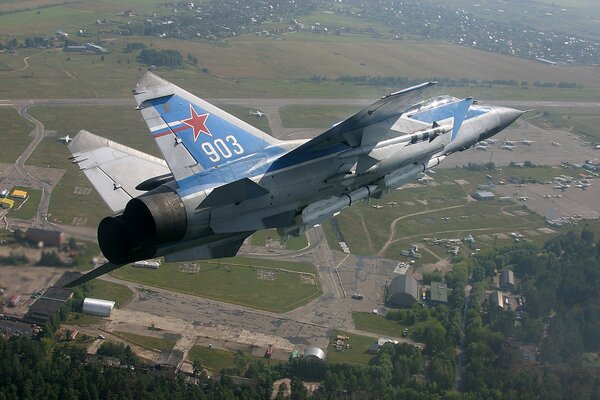 Mig-31 flies over the countryside