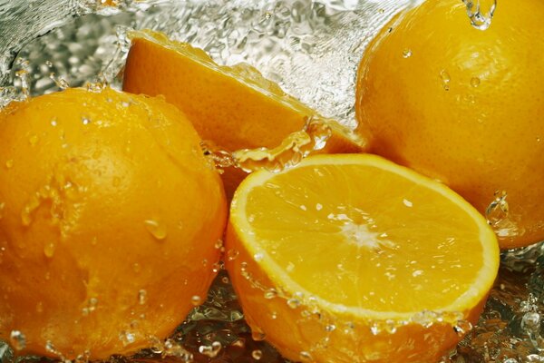 Macro photo of Lemons under a stream of water