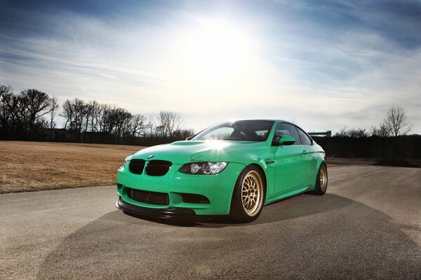 Bright green car road in the field