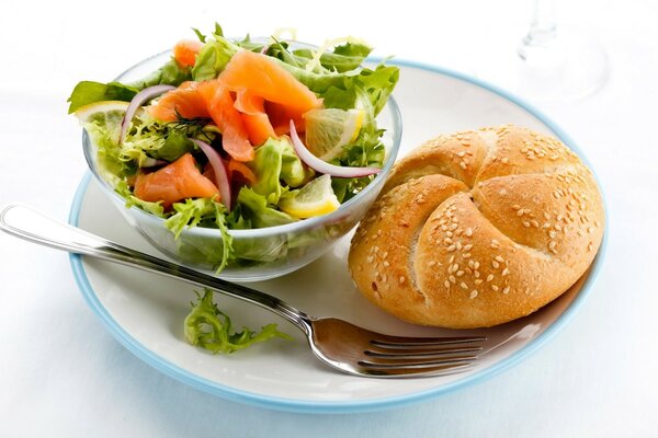 Salad with a bun on a white background