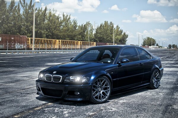 Dark blue BMW over blue clouds