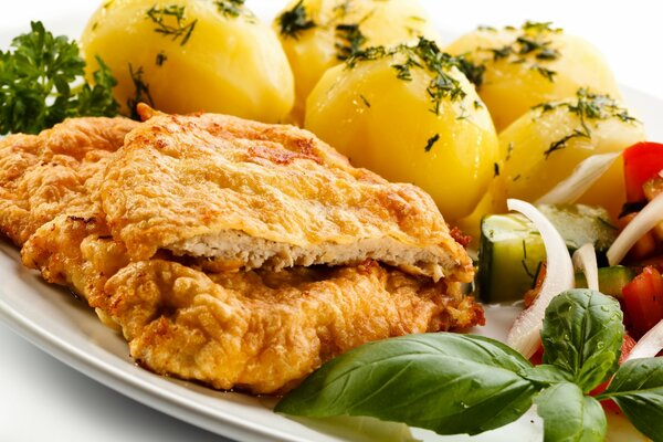 Lunch on a plate - cutlets, boiled potatoes and a little salad