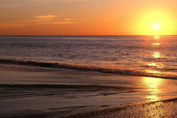 Sunrise over the surface of the ocean