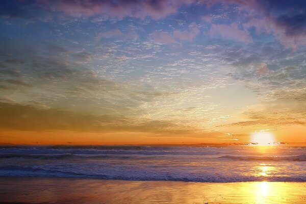 Waves, sand and a beautiful sky