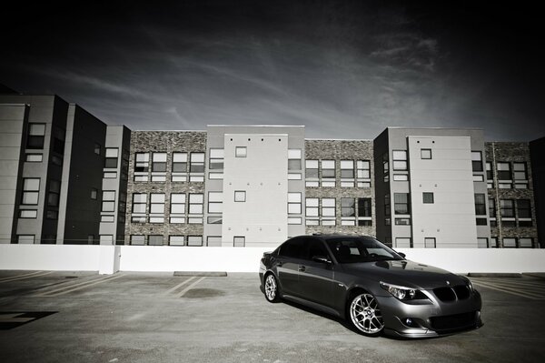 A black car in a gray city