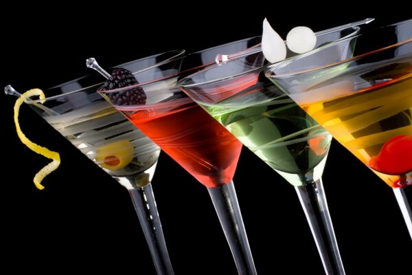 Multicolored cocktails on a black background