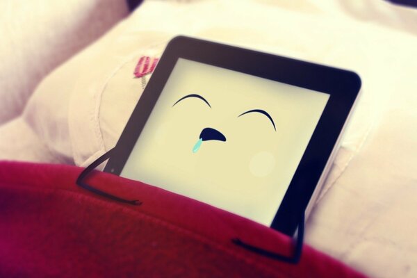 Background iPad on a pillow under a blanket