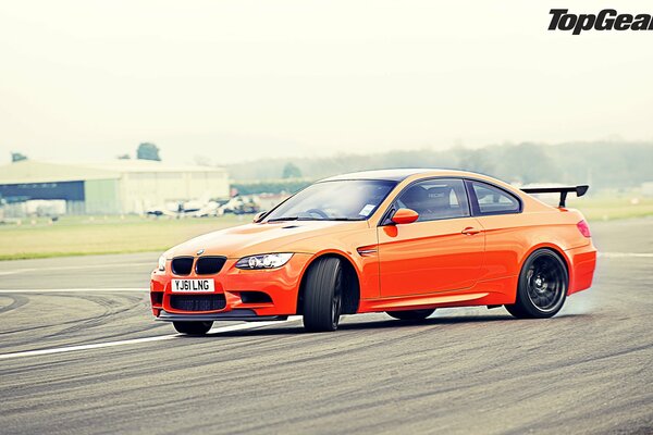 Orange supercar in a skid. Cool car in drift