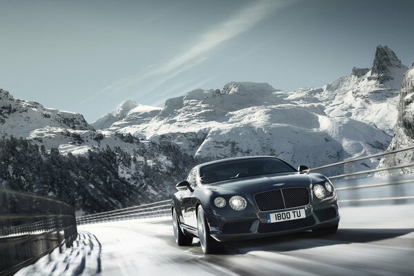 The car is rushing at high speed on a snowy road