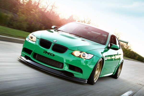 Green BMW tuning with a low fit