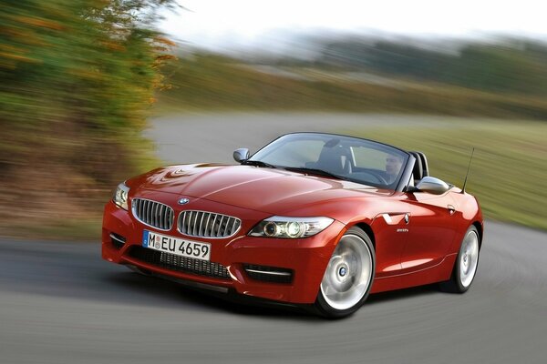 BMW convertible enters a turn at speed